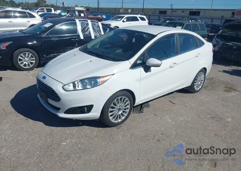2014 Ford Fiesta Titanium z USA, uszkodzony, nr VIN 3FADP4CJ9EM134881